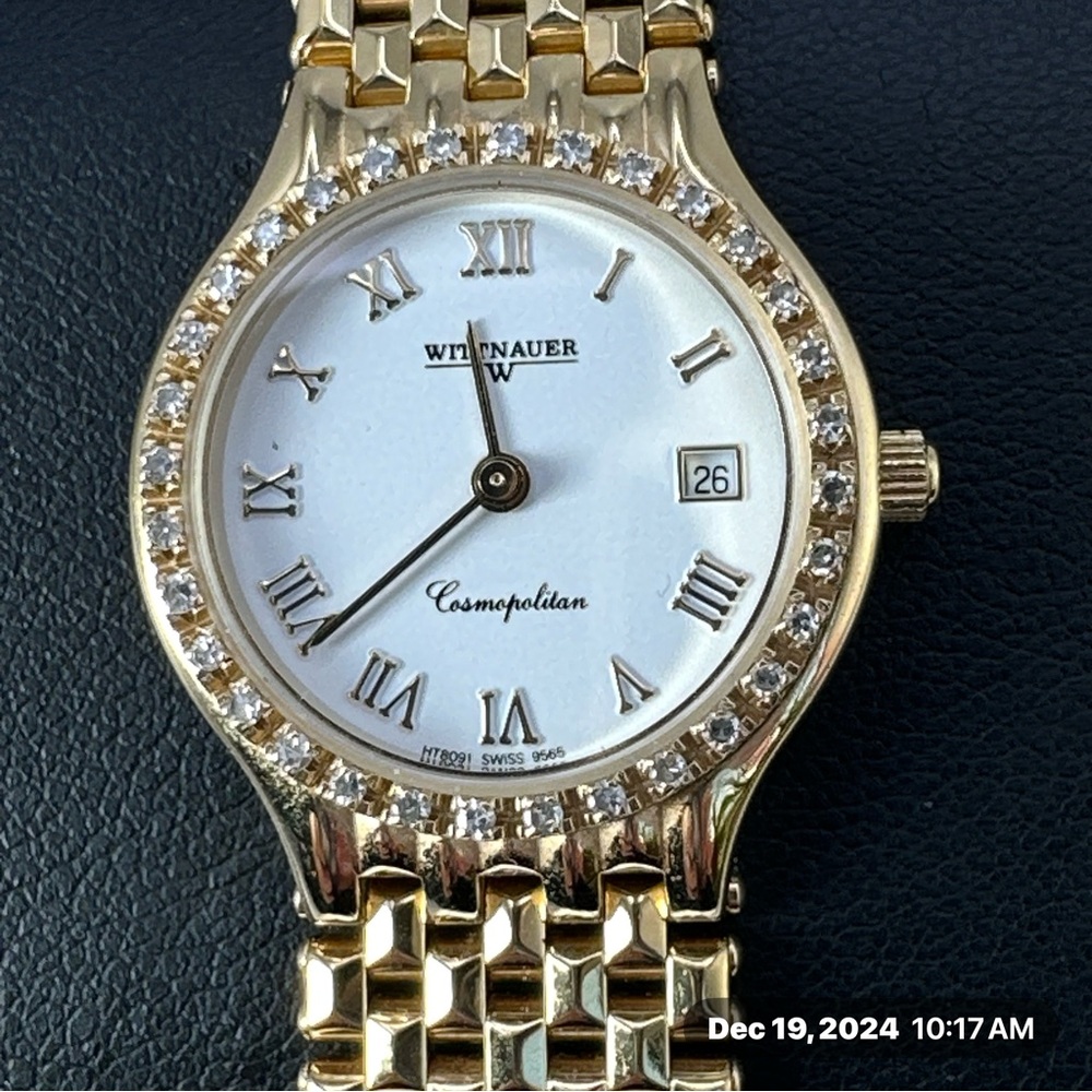 Wittnauer gold tone watch with diamonds